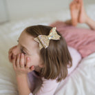 The Great Gold Bow Hair Clip by Great Pretenders 1 scaled